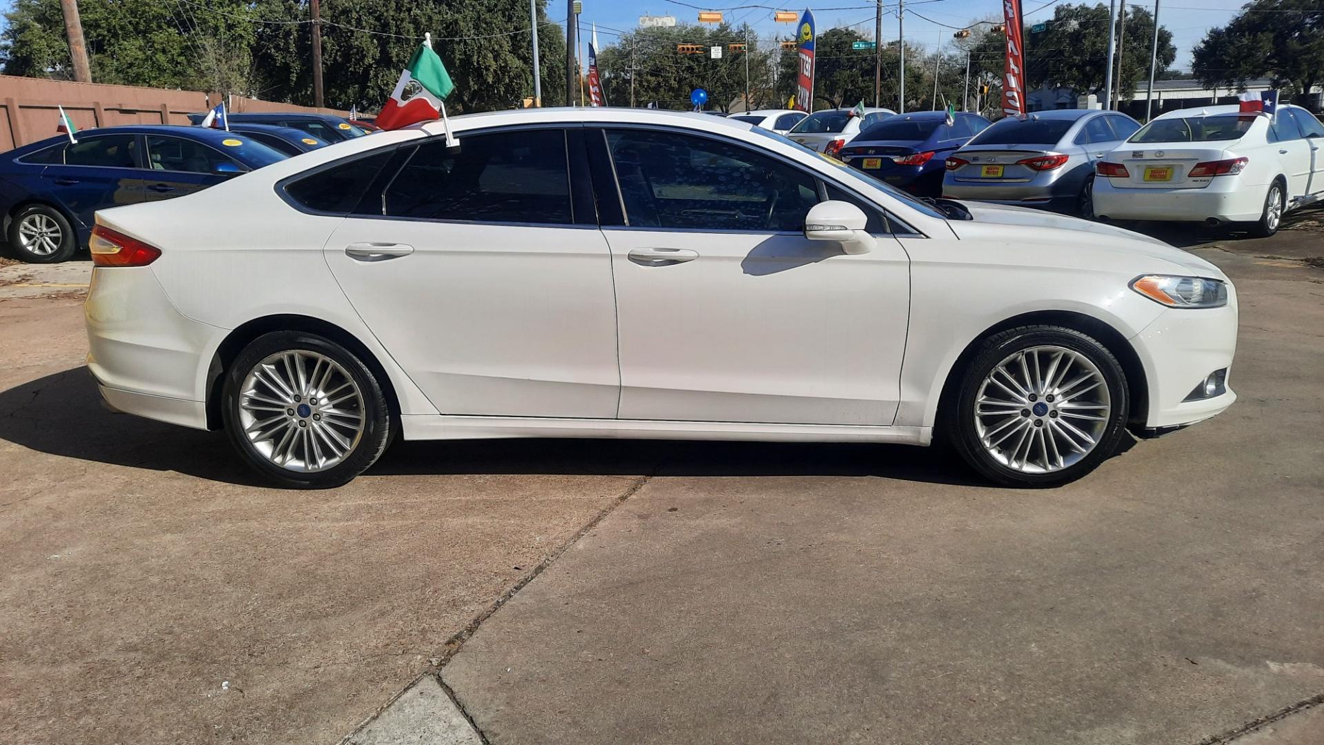 2016 Ford Fusion (3FA6P0HDXGR) , located at 16710 Clay Rd., Houston, TX, 77084, (281) 859-7900, 29.834864, -95.656166 - Photo#2